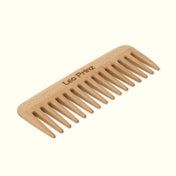 Detangling comb made from natural wood, featuring fine teeth for gentle hair grooming and styling.